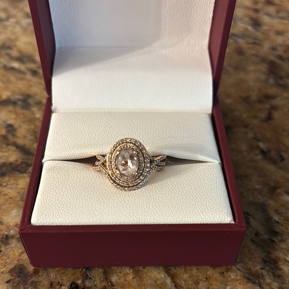 Rose Gold Ring with Round Central Stone and Halo Design